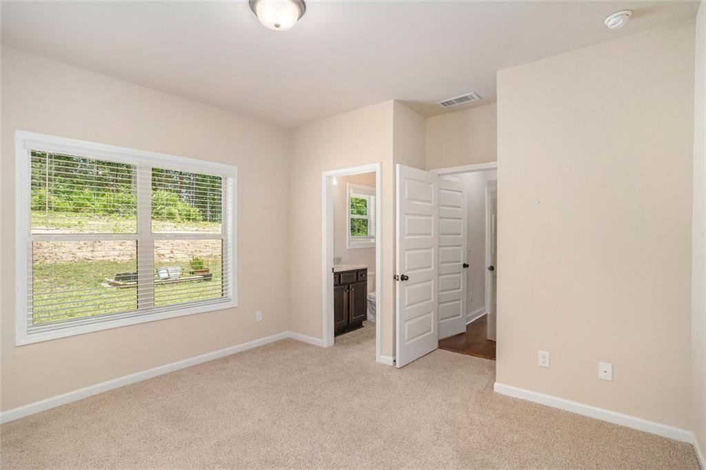 381 Homestead Circle Forsyth, GA 31029 - Photo 16 of 49 a view of an empty room with closet and a window
