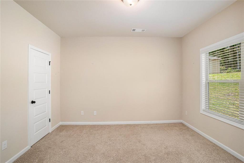 381 Homestead Circle Forsyth, GA 31029 - Photo 17 of 49 a view of an empty room with a window