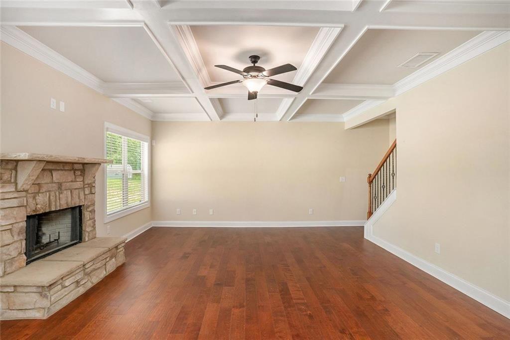 381 Homestead Circle Forsyth, GA 31029 - Photo 18 of 49 an empty room with windows and fireplace