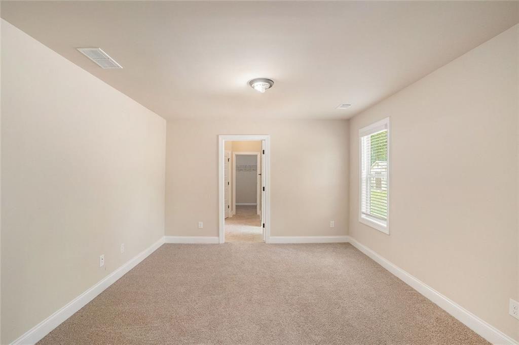 381 Homestead Circle Forsyth, GA 31029 - Photo 23 of 49 a view of an empty room with a window