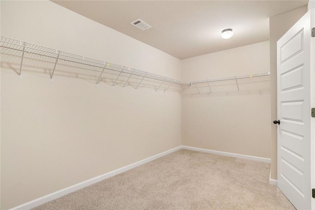 381 Homestead Circle Forsyth, GA 31029 - Photo 26 of 49 a view of a room with racks on the wall