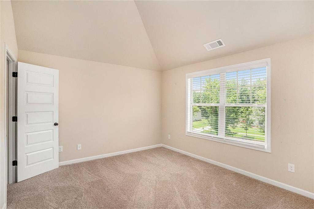381 Homestead Circle Forsyth, GA 31029 - Photo 29 of 49 an empty room with a window