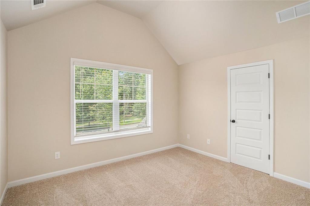 381 Homestead Circle Forsyth, GA 31029 - Photo 31 of 49 an empty room with a window