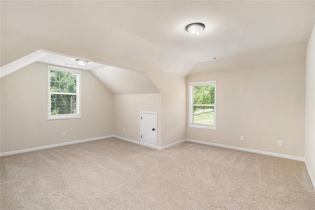 381 Homestead Circle Forsyth, GA 31029 - Photo 35 of 49 an empty room with windows