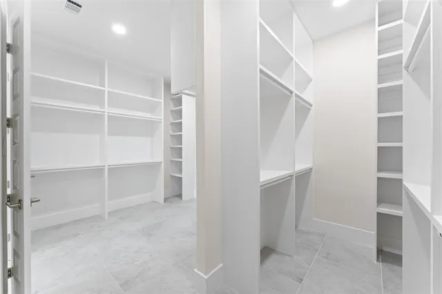 a view of an empty walk in closet
