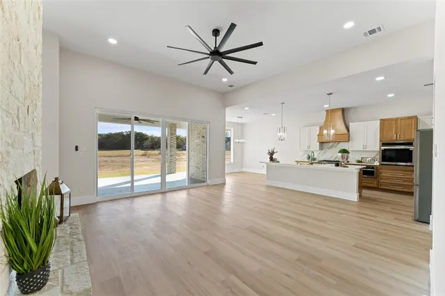 a view of a kitchen with a sink and a stove top oven