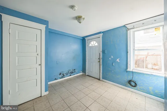 a bathroom with a tub shower and sink