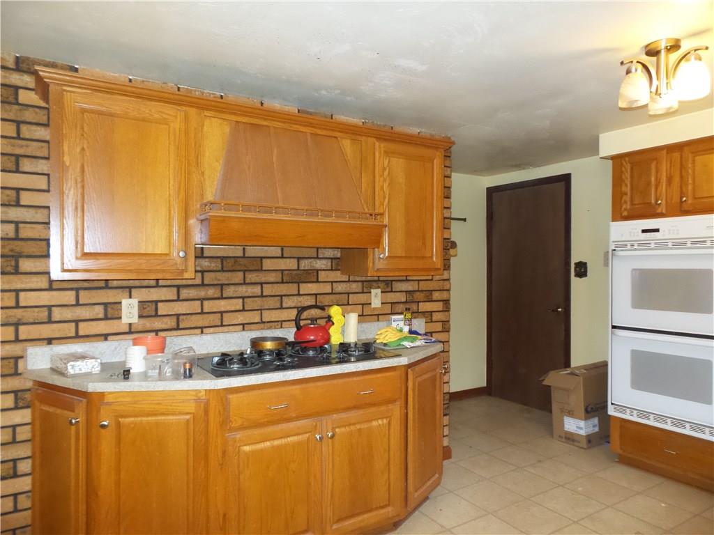 2230 Hyland Road Harrison City, PA 15636 - Photo 8 of 25 Cook top was propane, but tank has been removed. Can be converted to electric like the rest of the house.