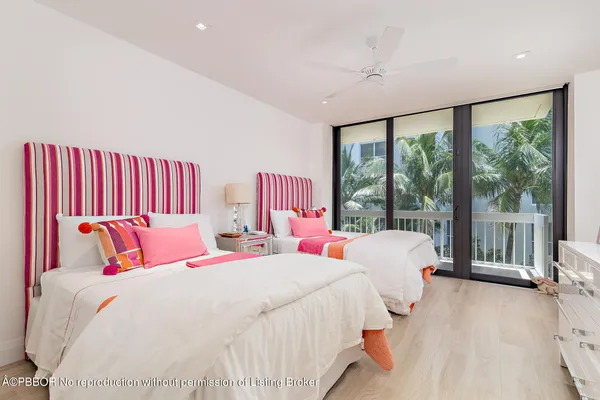 a bedroom with a large bed and a large window