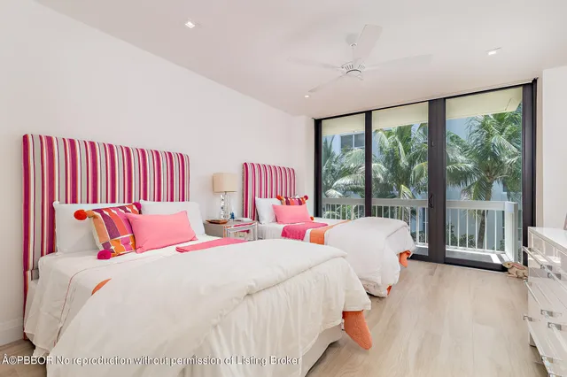 a bedroom with a large bed and a large window