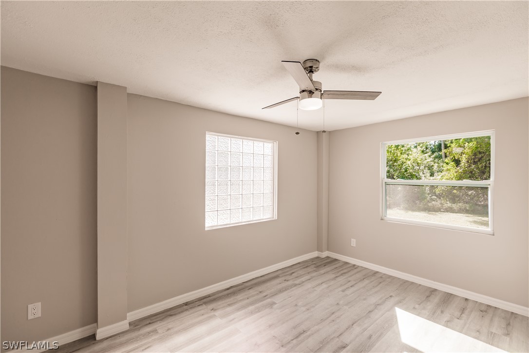 8049 Albatross Road Fort Myers, FL 33967 - Photo 16 of 35 a view of an empty room with a window