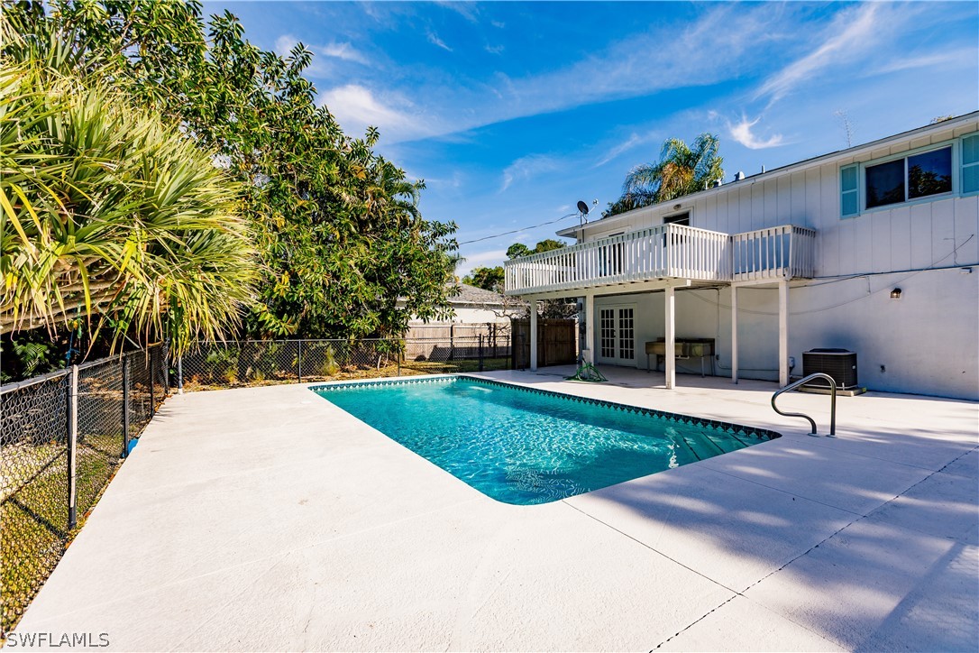 8049 Albatross Road Fort Myers, FL 33967 - Photo 30 of 35 a view of a house with backyard and sitting area