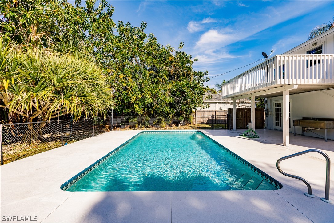 8049 Albatross Road Fort Myers, FL 33967 - Photo 31 of 35 a view of backyard with swimming pool and seating space