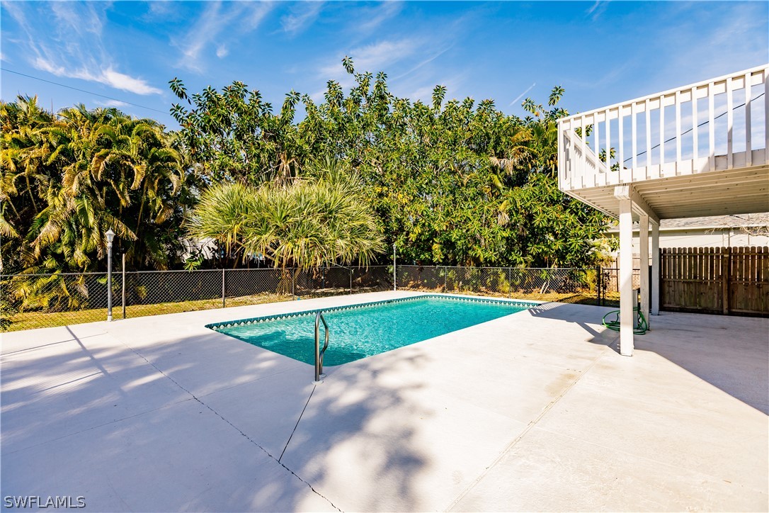 8049 Albatross Road Fort Myers, FL 33967 - Photo 32 of 35 a view of a backyard with swimming pool