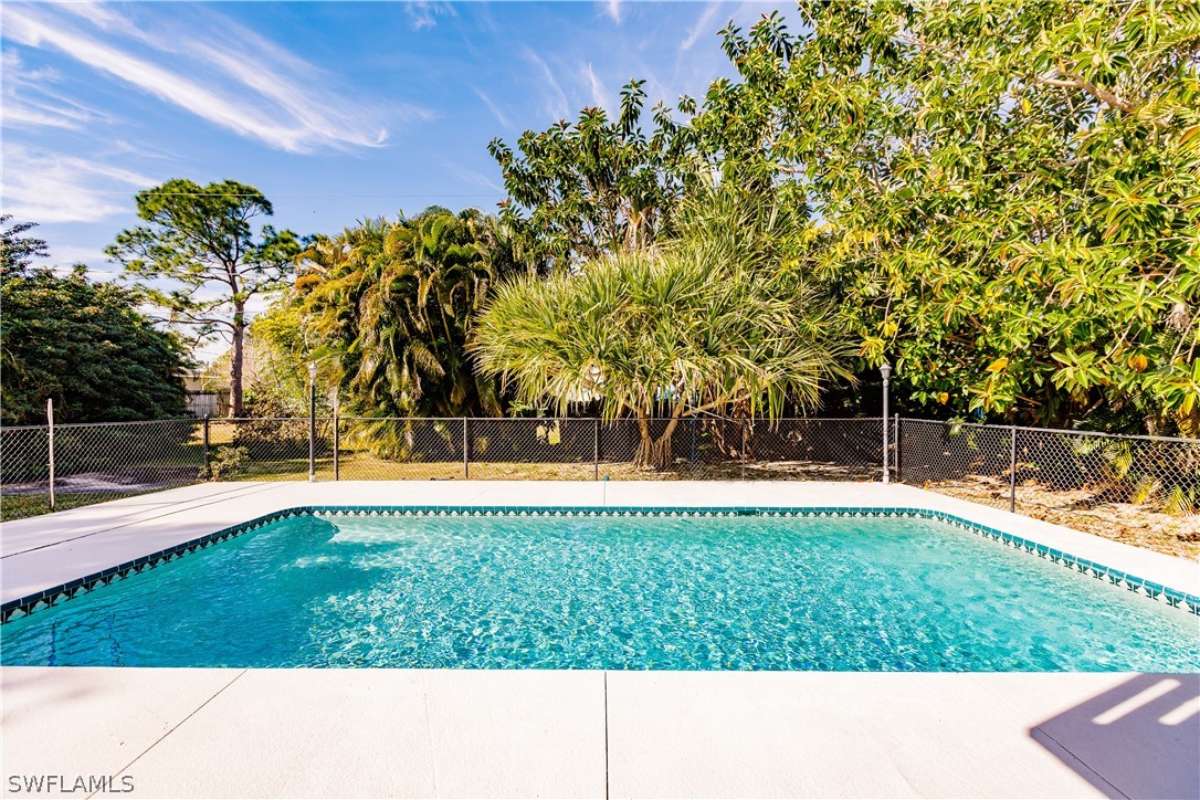 8049 Albatross Road Fort Myers, FL 33967 - Photo 33 of 35 a view of swimming pool with a yard