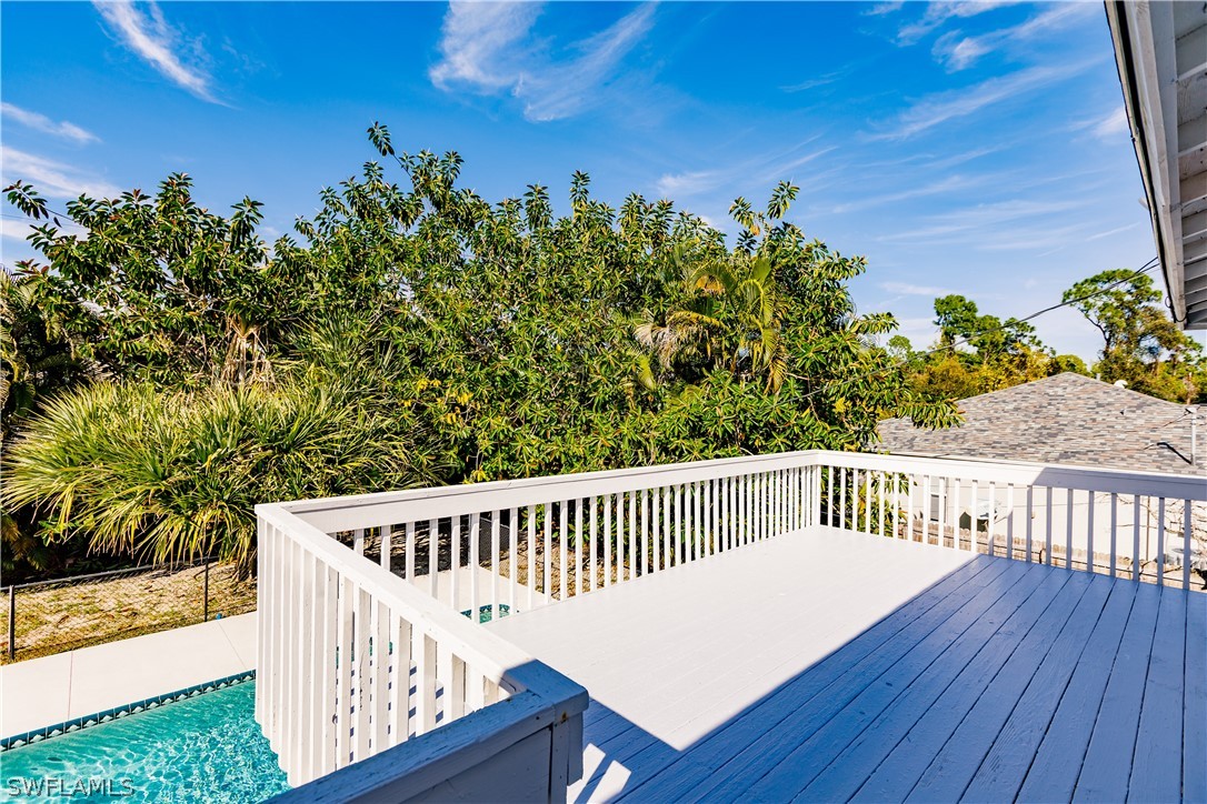 8049 Albatross Road Fort Myers, FL 33967 - Photo 35 of 35 a view of a wooden deck and a backyard