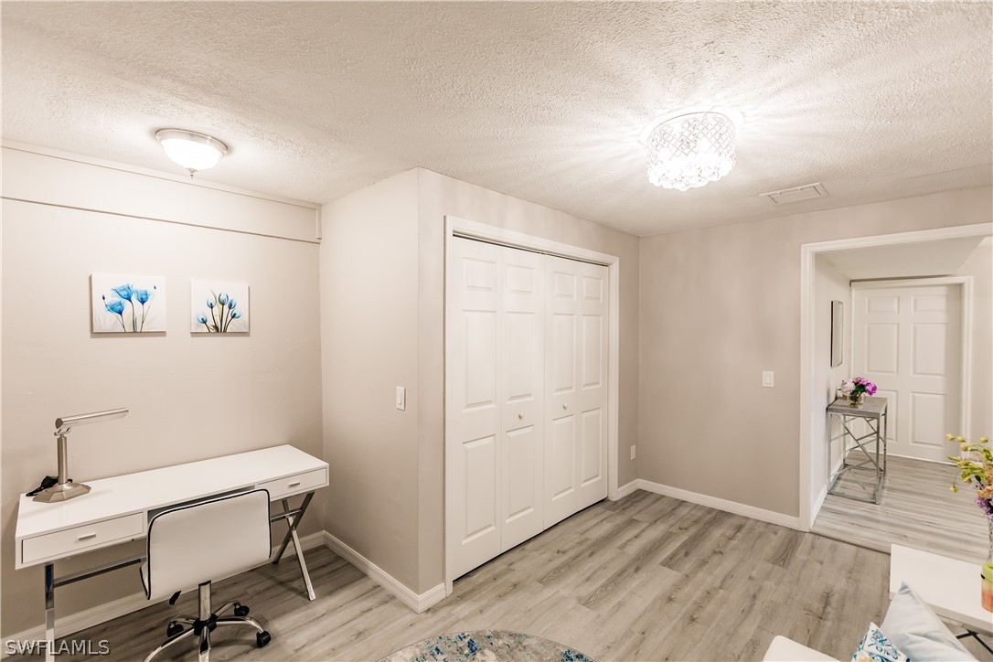 8049 Albatross Road Fort Myers, FL 33967 - Photo 7 of 35 a view of a room with gym equipment