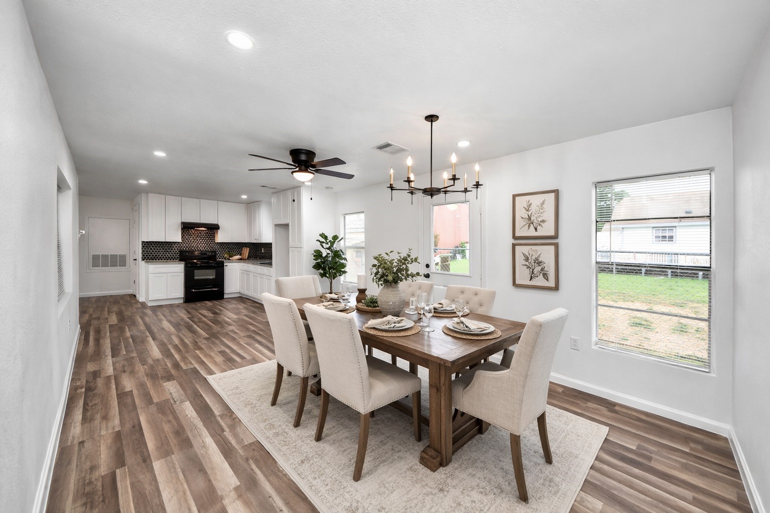 207 East Defee Avenue Baytown, TX 77520 - Photo 20 of 36 a view of a dining room with furniture window and wooden floor