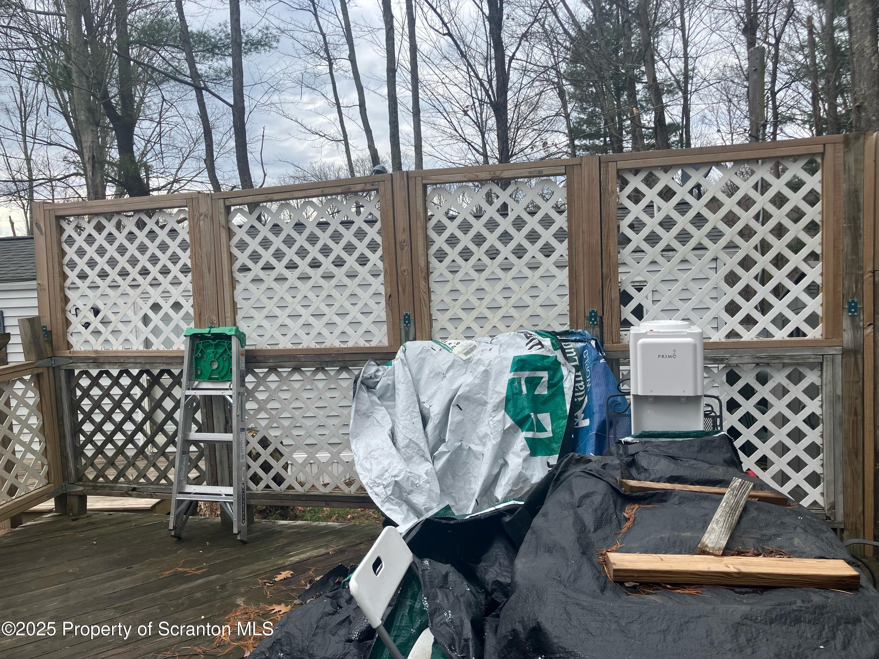 144 Old Loggers Road Factoryville, PA 18419 - Photo 3 of 14 a view of a chairs and table in backyard