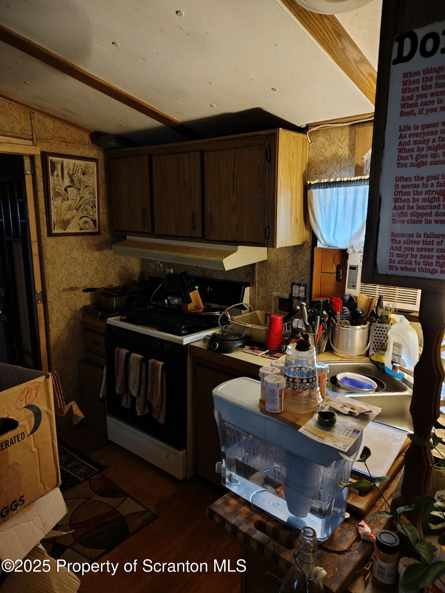 144 Old Loggers Road Factoryville, PA 18419 - Photo 4 of 14 a kitchen with a sink and a stove top oven