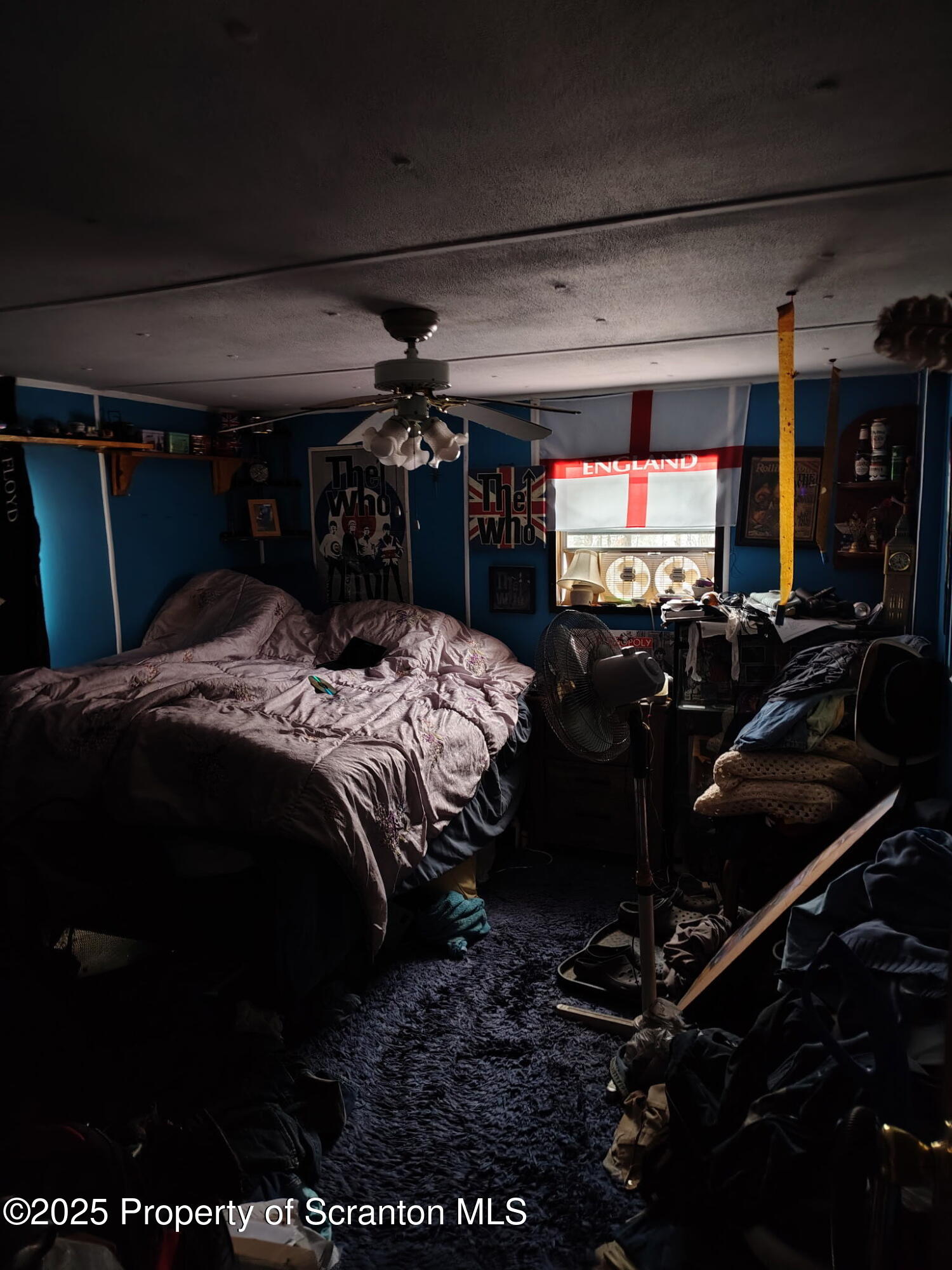 144 Old Loggers Road Factoryville, PA 18419 - Photo 8 of 14 a bed room with a bed and a television