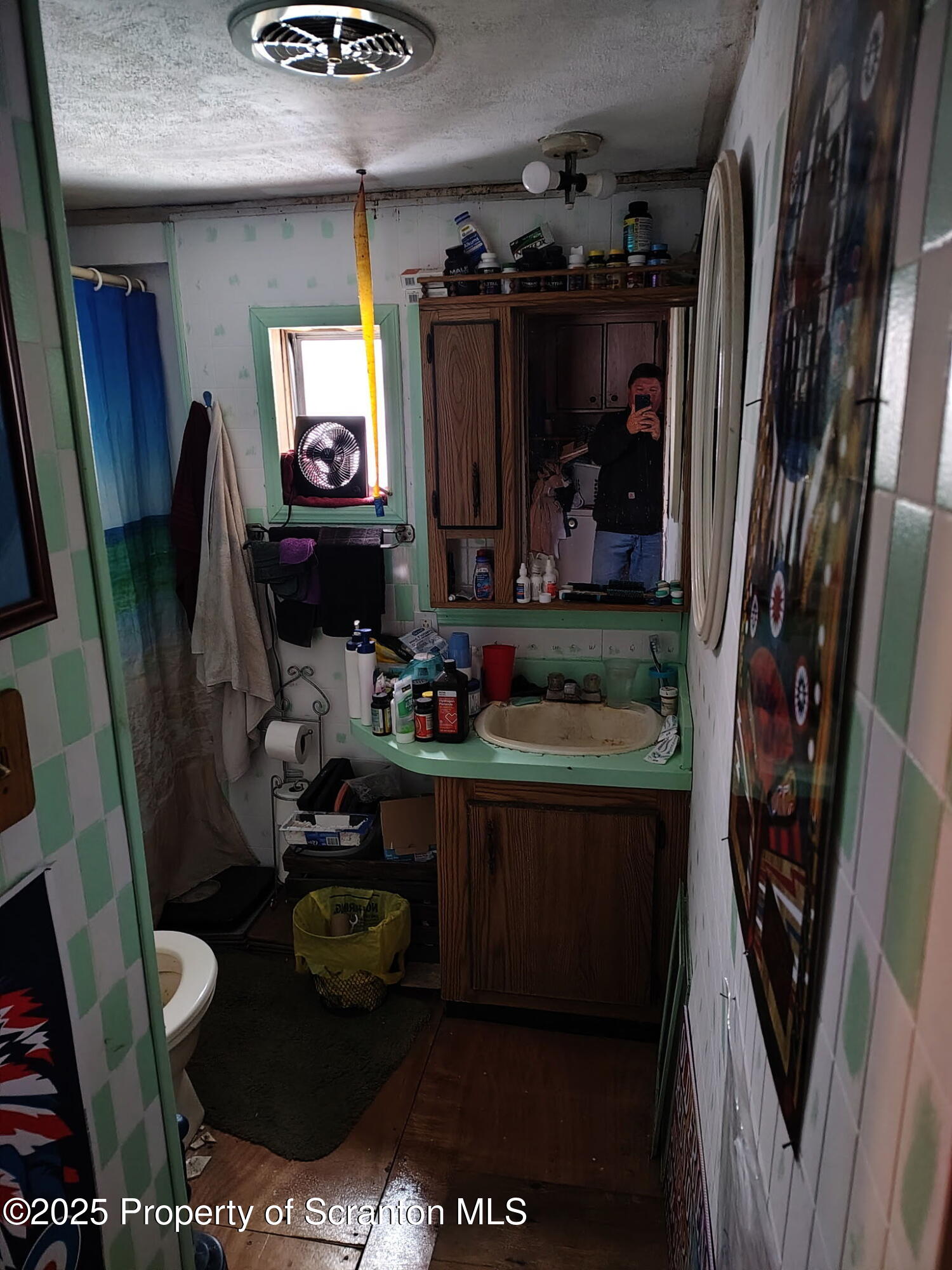 144 Old Loggers Road Factoryville, PA 18419 - Photo 10 of 14 a bathroom with sink and a mirror