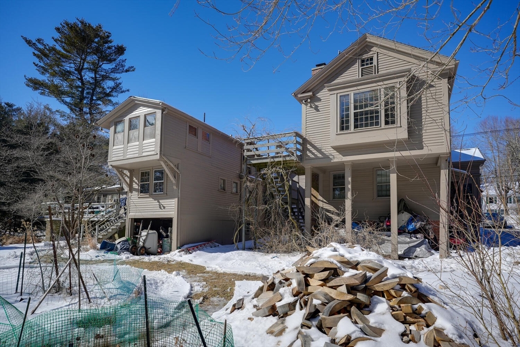 209 Main Street, Unit B Medway, MA 02053 - Photo 12 of 12 a front view of a house with a yard