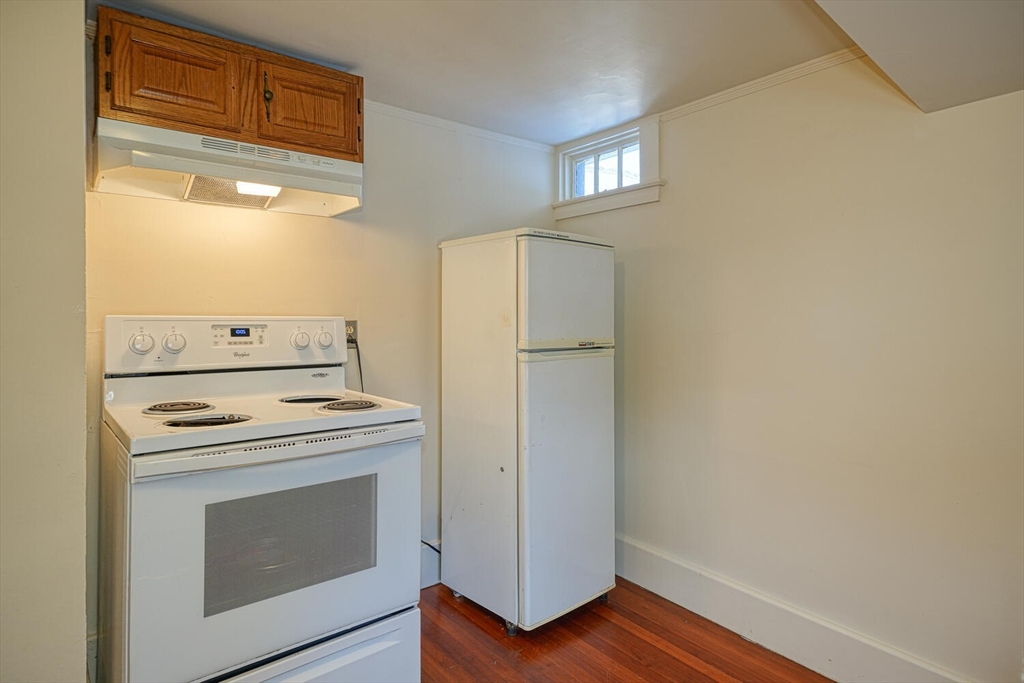 209 Main Street, Unit B Medway, MA 02053 - Photo 4 of 12 a kitchen with a stove and a refrigerator