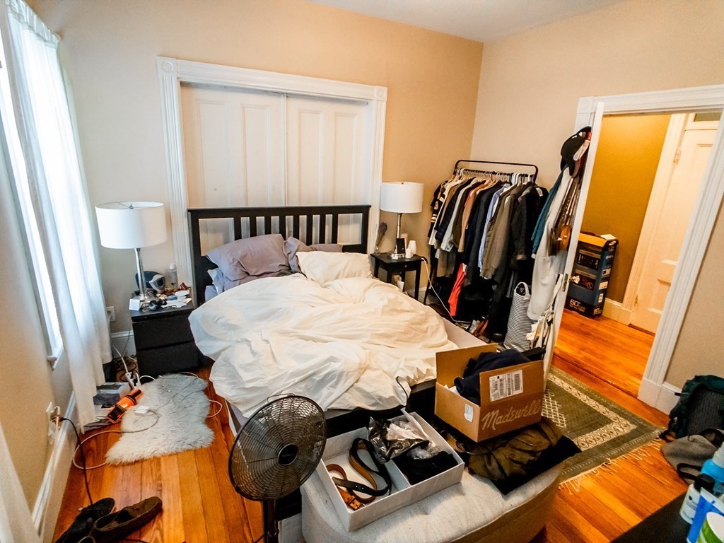 30 Spring Park Avenue, Unit 3 Boston, MA 02130 - Photo 6 of 12 a bed sitting in a bedroom next to a window