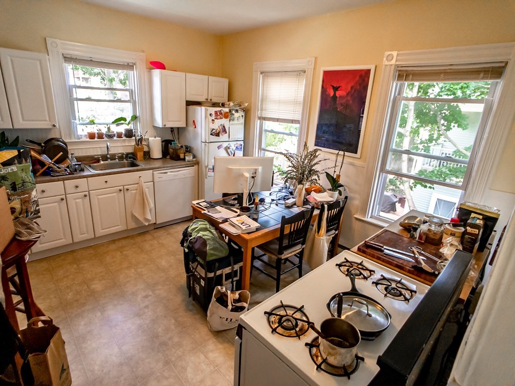 30 Spring Park Avenue, Unit 3 Boston, MA 02130 - Photo 9 of 12 a work place with furniture a flat screen tv and a window