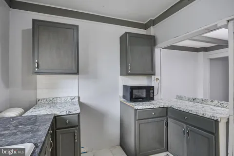 a kitchen with a stove and a sink