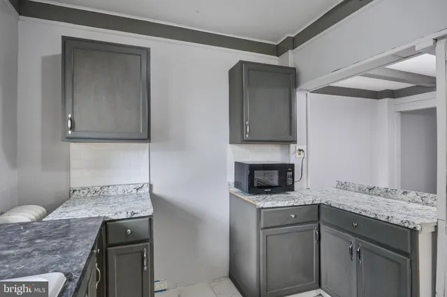 a kitchen with a stove and a sink