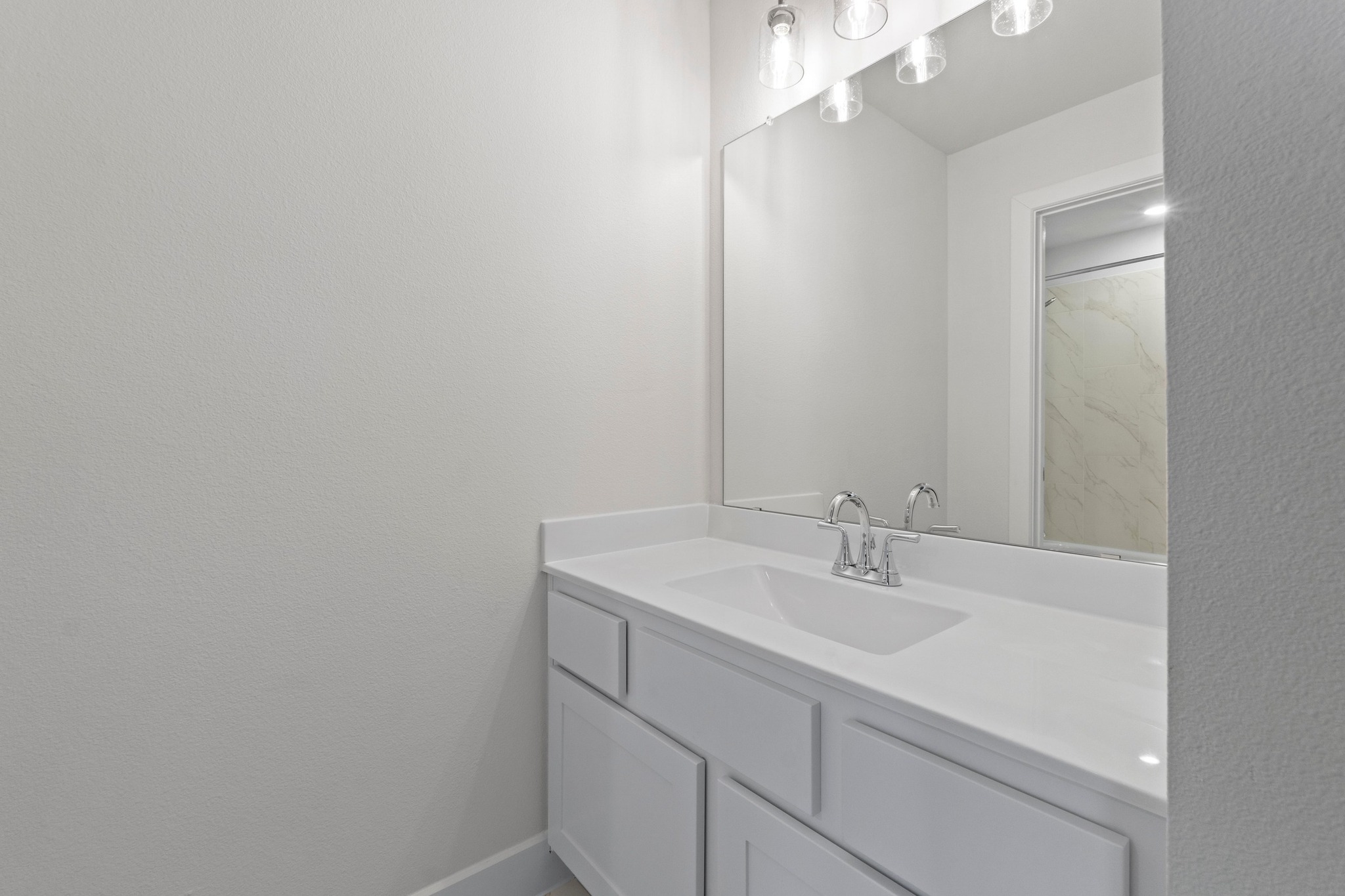 604 Lightstone Drive Georgetown, TX 78633 - Photo 25 of 39 a bathroom with a sink and a mirror