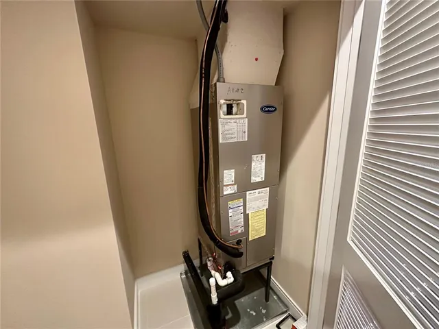 a view of a hallway with wooden floor and entryway