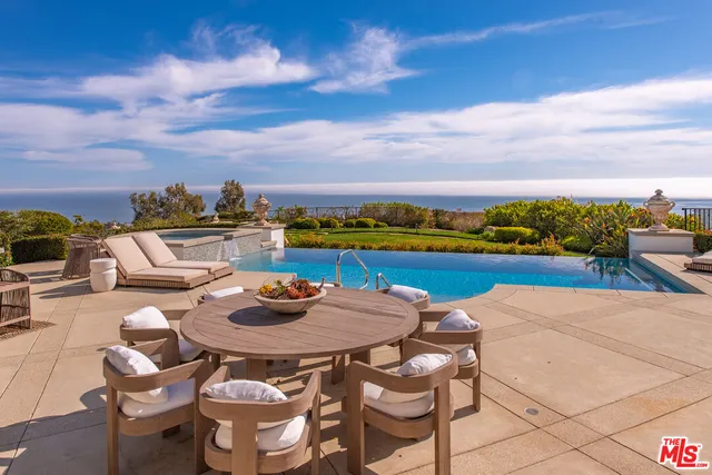 a view of a balcony with an ocean view