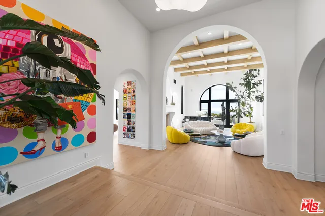 a view of living room with furniture and flowers