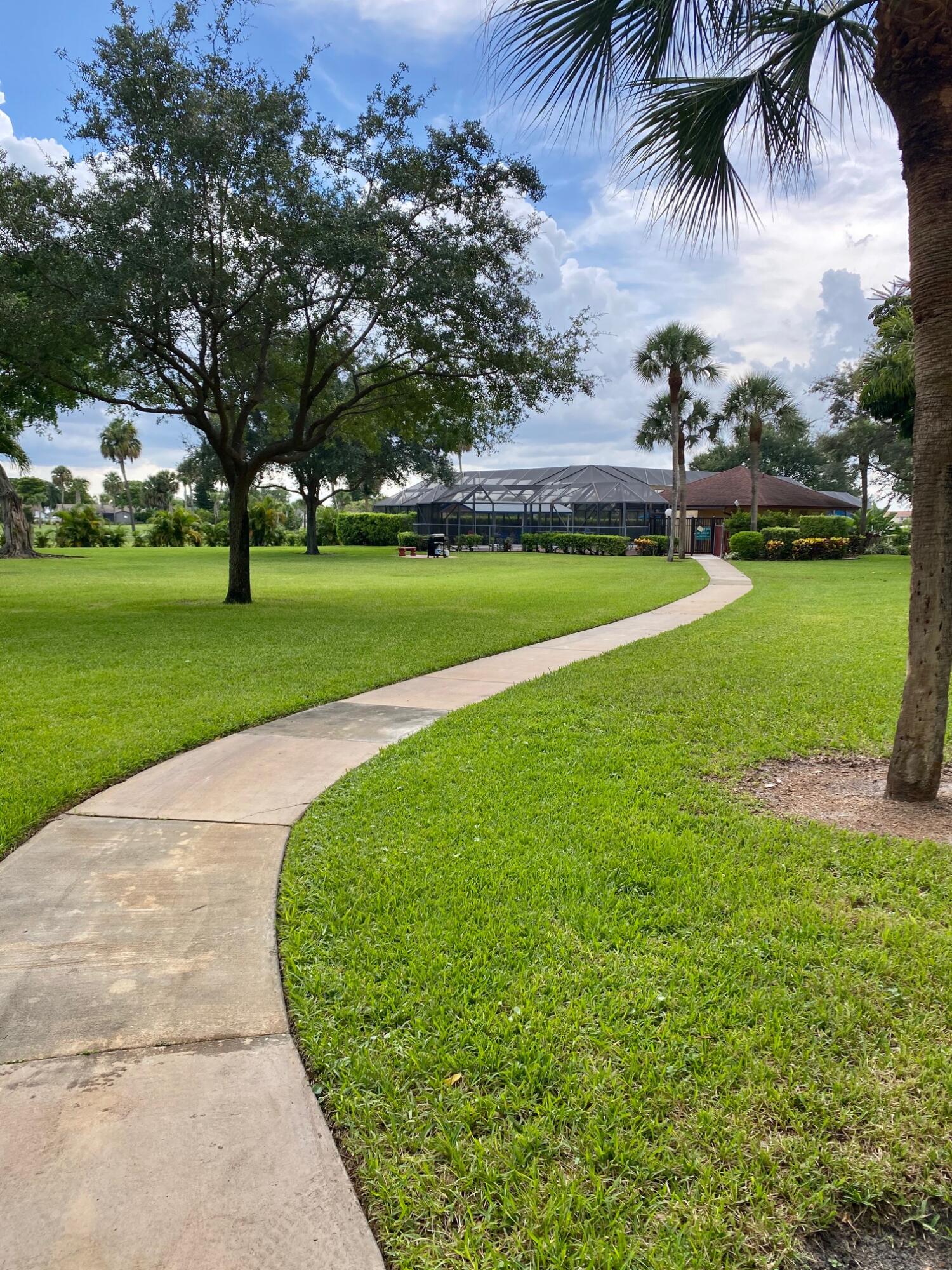 9170 Southwest 14th Street, Unit 4405 Boca Raton, FL 33428 - Photo 37 of 48 a view of outdoor space yard and lake view