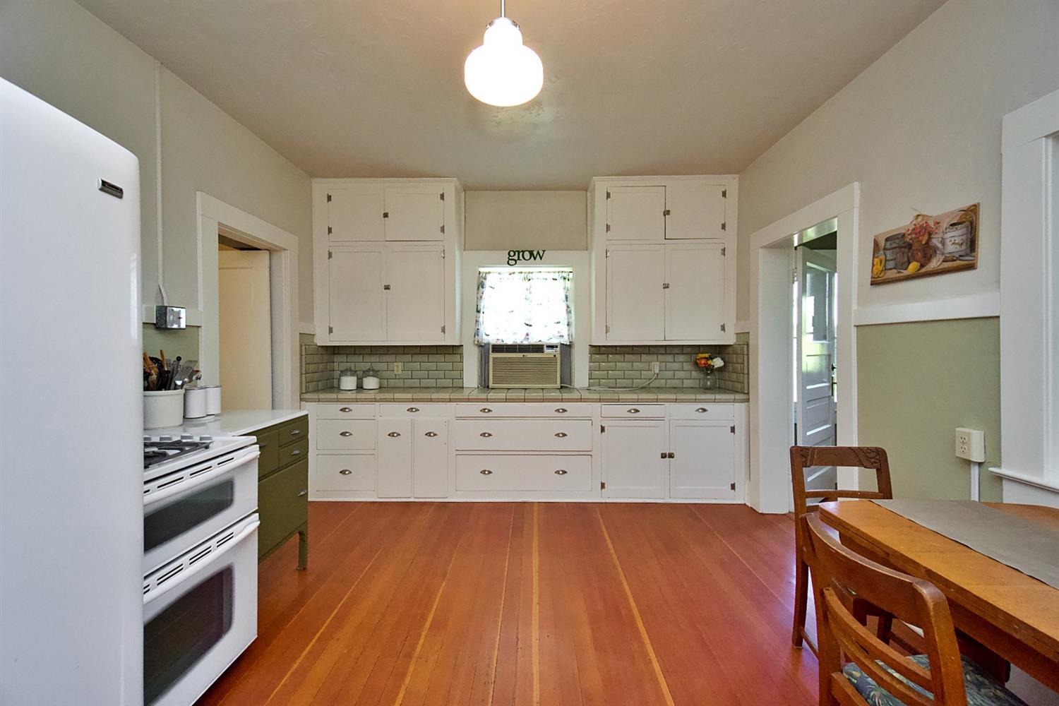 2220 Dewitt Avenue Clovis, CA 93612 - Photo 19 of 44 a kitchen with stainless steel appliances a stove refrigerator and cabinets