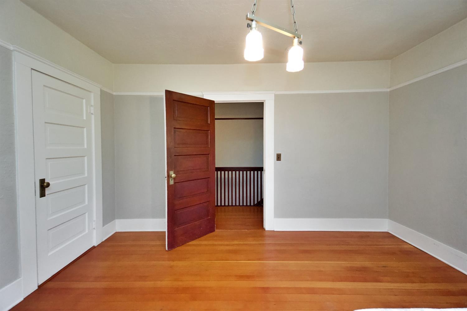 2220 Dewitt Avenue Clovis, CA 93612 - Photo 28 of 44 an empty room with wooden floor closet and windows