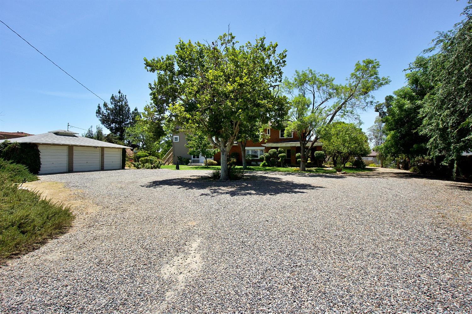 2220 Dewitt Avenue Clovis, CA 93612 - Photo 41 of 44 a front view of a house with a yard and trees