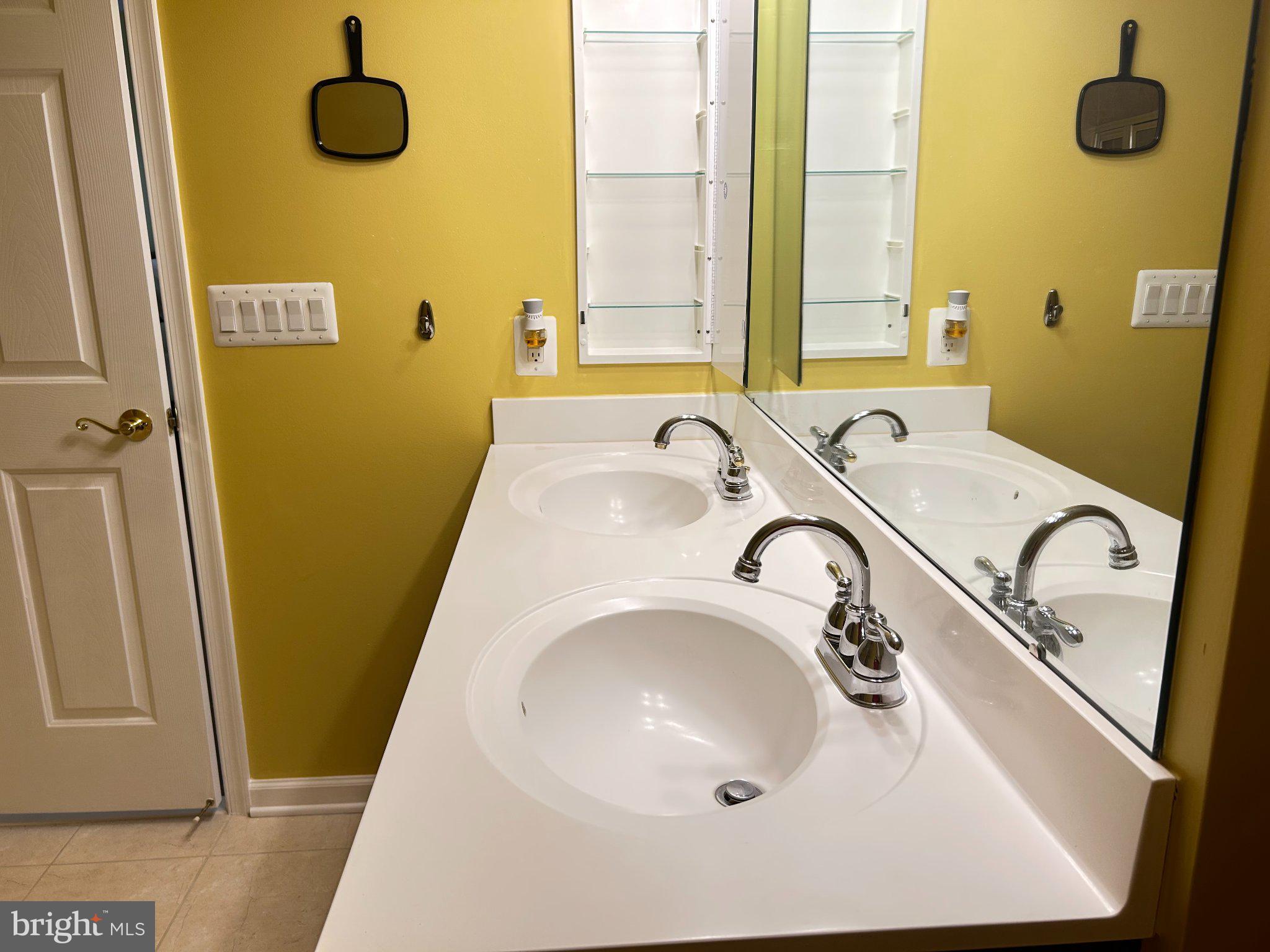 2001 Connor Court, Unit 704D Bowie, MD 20721 - Photo 32 of 33 Bright and airy dual-sink bathroom.
