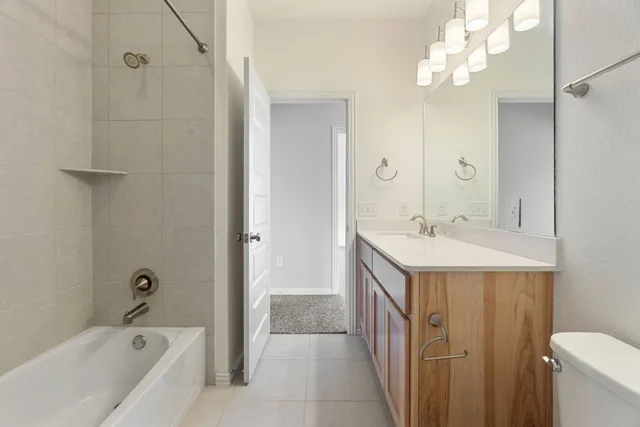 a view of a house with a backyard and a tree