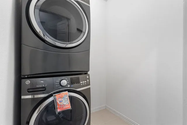 a view of a house with a yard and wooden fence