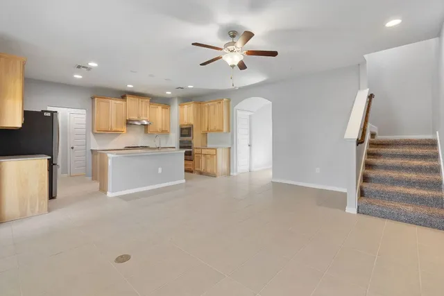 a kitchen with a sink cabinets and stainless steel appliances
