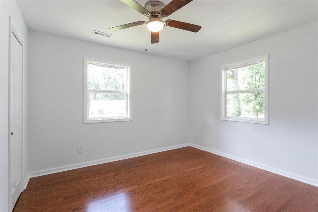 4144 Canby Lane Decatur, GA 30035 - Photo 3 of 6 wooden floor in an empty room with a window