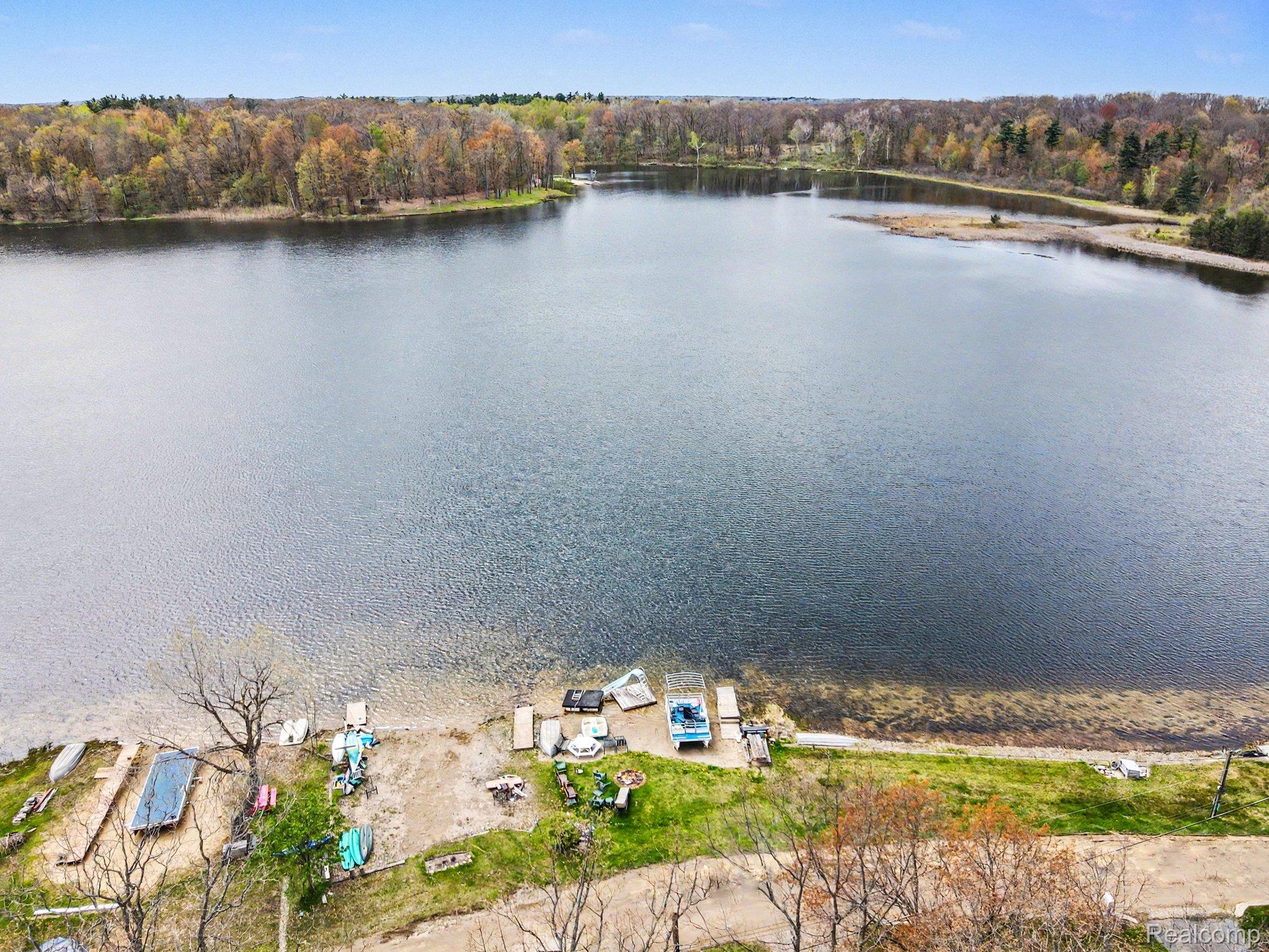 4375 Skinner Lake Road Lapeer, MI 48446 - Photo 5 of 30 Bird's eye view of a large body of water and a heavily wooded area