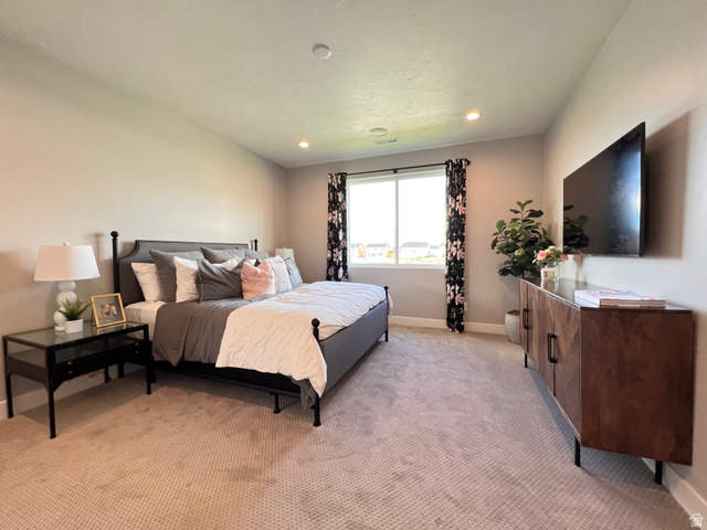 1951 2900 West Provo, UT 84601 - Photo 11 of 21 Spacious room featuring neutral carpeting, recessed ceiling lighting, and a window with dark curtain rods