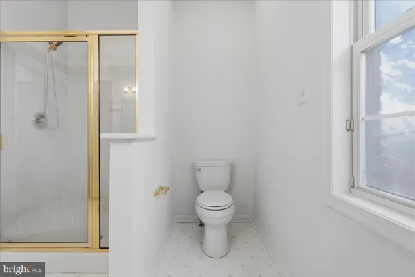 a view of a room with wooden floor and closet