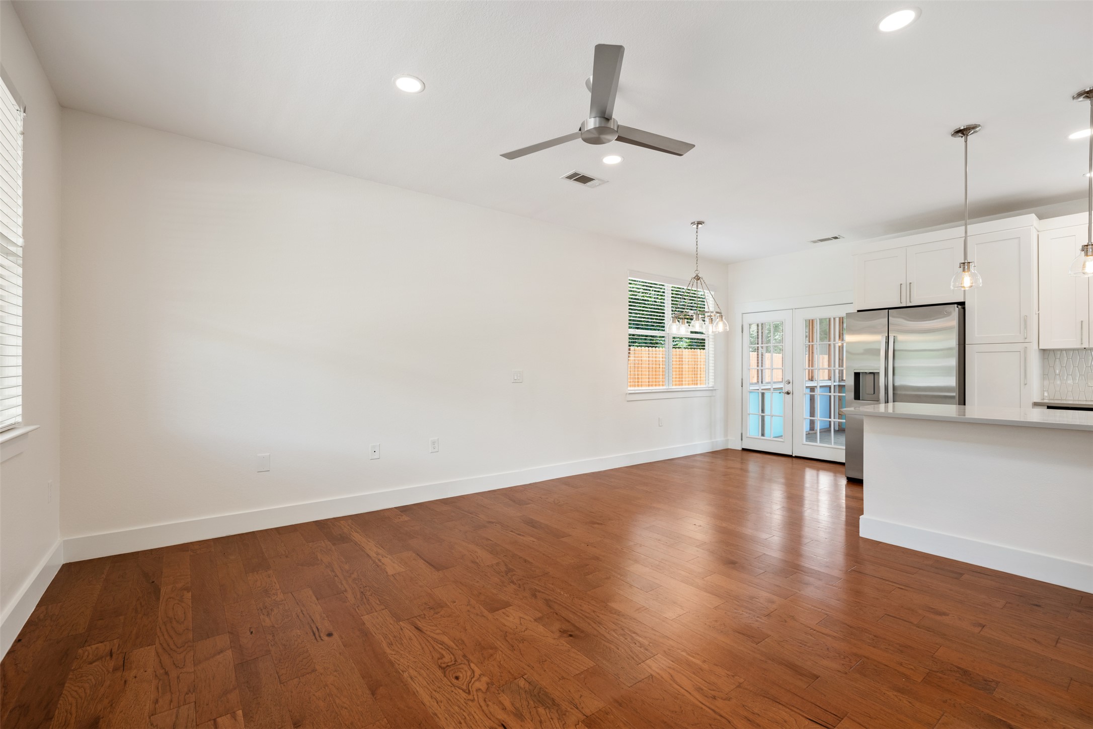 4912 Sara Drive, Unit A Austin, TX 78721 - Photo 4 of 28 Open-concept living room with hardwood floors and high ceilings.