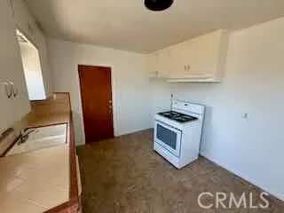 a kitchen with a stove and a microwave